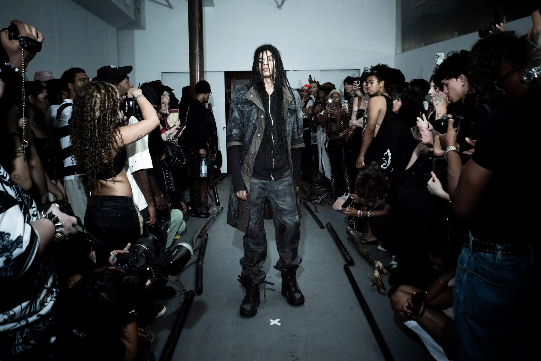 ½ Sleeve Double Coated “Militia” Trench / Ribbed Gauze Zip-Hoodie / “Moto” Armoured Denim worn together on the runway